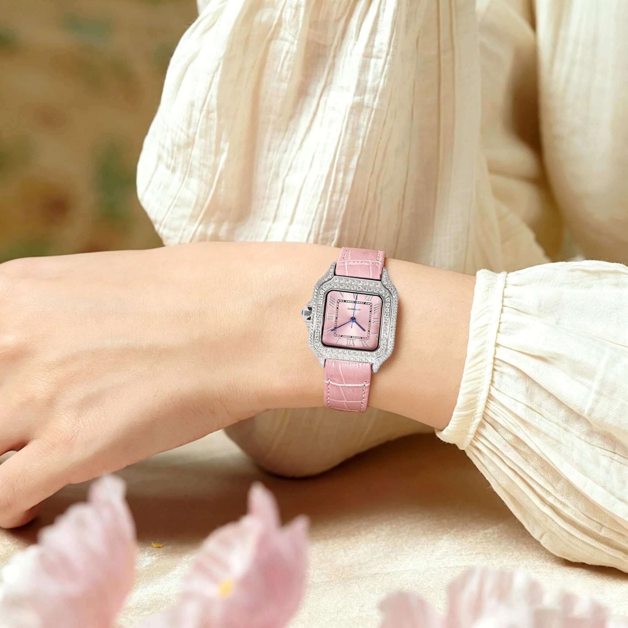 The women's square moissanite watch worn with a pink strap