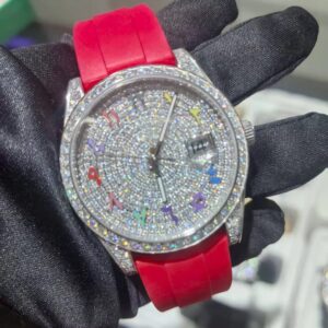 Round moissanite pavé watch with colored numerals on a red rubber strap