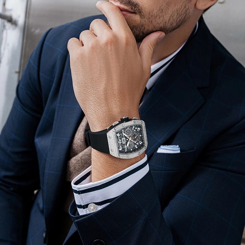 The gem-set tonneau watch worn with a navy suit